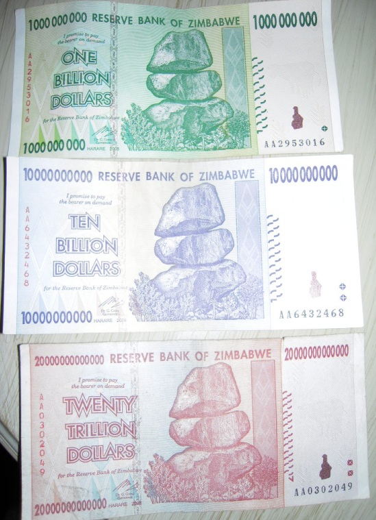 Images of 3 Zimbabwean dollar bills: 1 billion dollars, 10 billion dollars, 20 trillion dollars